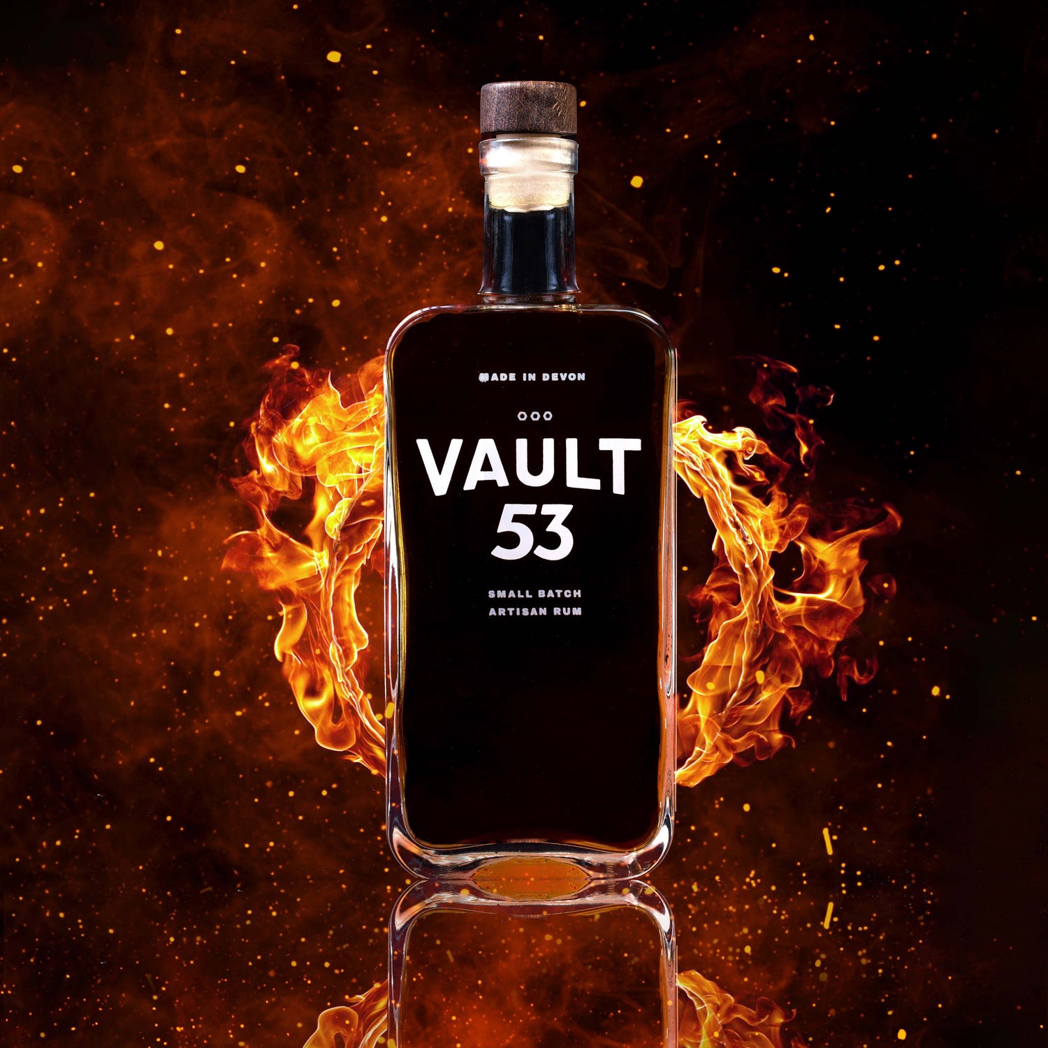 Bottle of Vault 53 rum with flames in the background